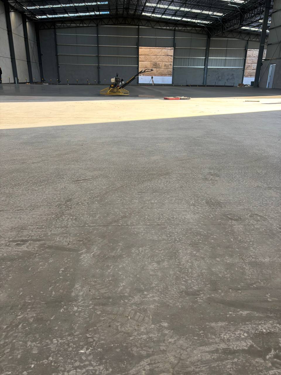 Large industrial concrete floor with power trowel finish